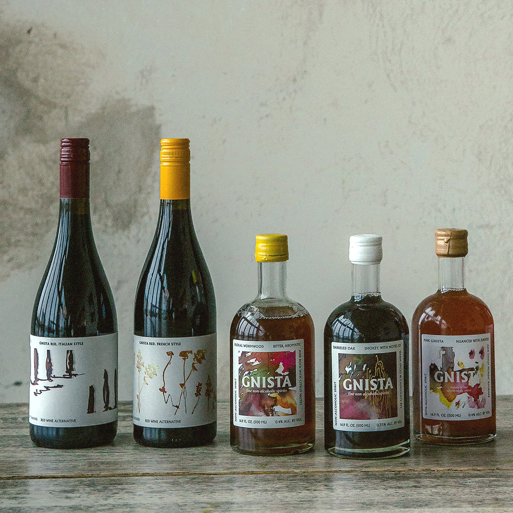 Five bottles of different types of alcohol free wines and spirit